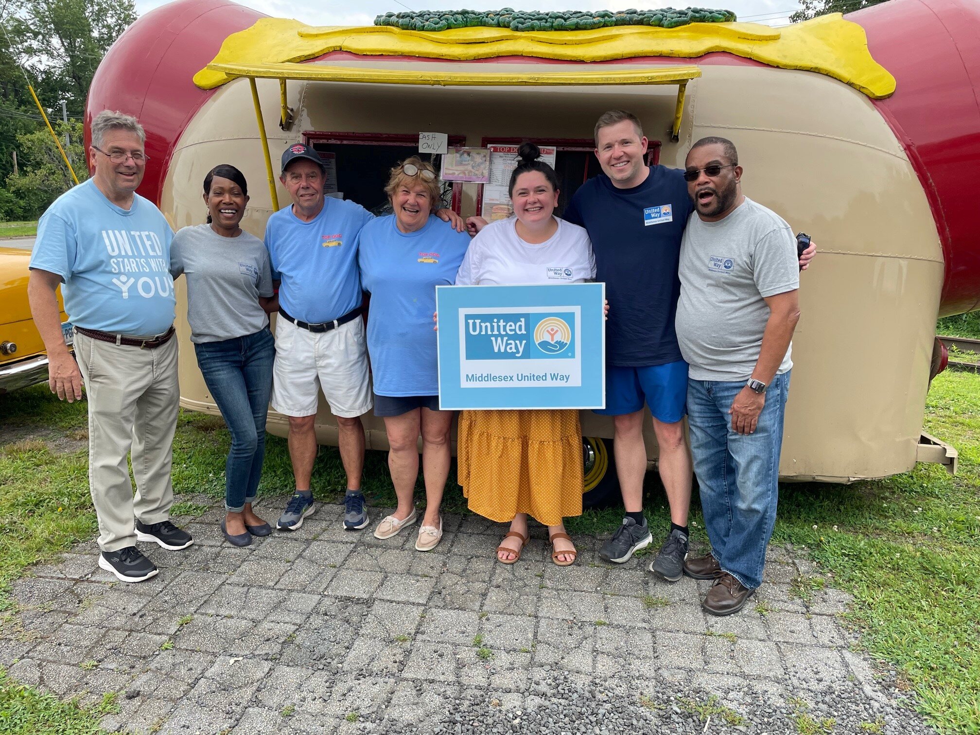 Group shot with staff and owners of Top Dog Food Stand